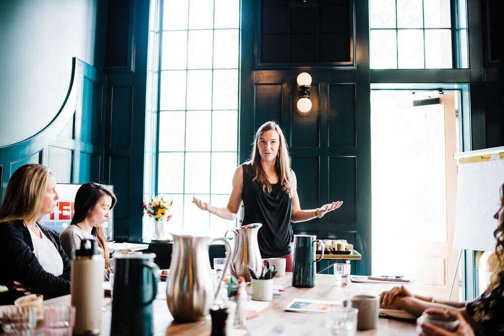 Business leader presenting to a team during a storytelling workshop